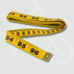 Yellow measuring tape for sewing, tailoring, and garment fitting
