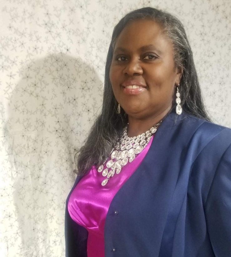 Carolyn wearing her unfinished satin crepe dress made for the commemoration of Jesus Christ during the pandemic.