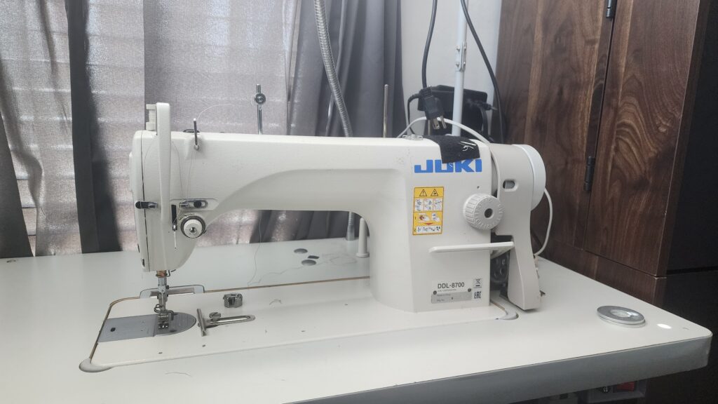 A Juki DDL-8700 industrial sewing machine, the technical foundation for the Academy of Sewing's tailored construction tutorials.