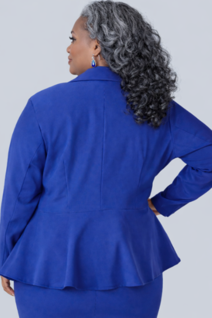 The back view of an ill-fitting blazer on a model, highlighting the structural gaps that The Academy of Sewing's methods are designed to solve.