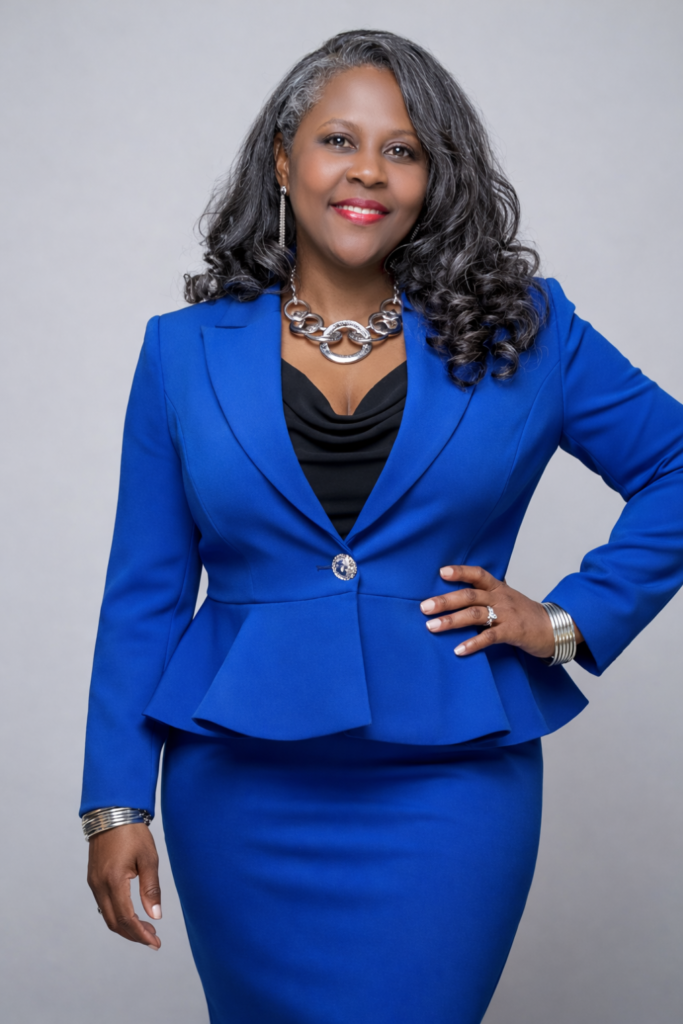 A woman in a perfectly tailored cobalt blue peplum blazer, demonstrating professional fit and sophisticated style for plus-size figures.