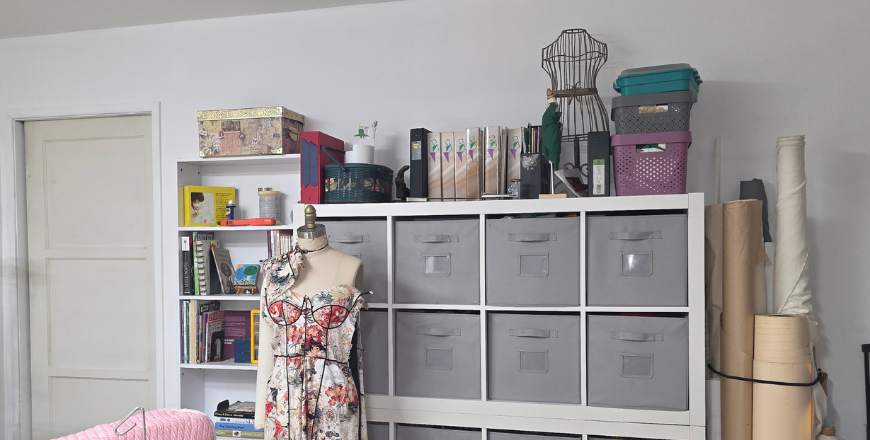 The Academy of Sewing professional studio workspace, featuring organized tailoring supplies and specialized equipment for plus-size garment construction.